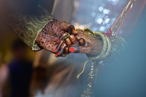 Bride adorned in traditional gold jewellery and bridal makeup